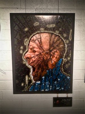 Cult of Ego II | Gallery Photo | Burnt Sky | Breaking Through — Something I tried differently for this show was a technique of hanging my tags from the main piece itself. A bit different from the last show we saw. I had, initially had more funding for framing, but it got eaten up in other things, and I will tell you that doing pieces of artwork this size is not exactly cheap. Either way, this is what we're going to see through the next three galleries. Quarter-inch MDF, extremely high-quality Epson digital print, and here we have it on a brick wall in a little gallery about a block south of Roosevelt Row.