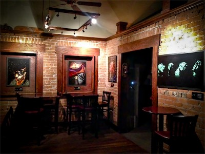 Cult of Ego II | Gallery Photo | Lost Leaf — This is a great place. An old house, revamped and turned into a bar / community space, originally a speakeasy. Very, very popular, and always full of people. Sadly, I don't think it exists anymore, as the downtown Phoenix 5th Street area was pretty much fully gentrified. The same buildings still do exist there, but they've all been taken over by other people. A few of the businesses that were there at the time are still around, such as the gallery that you're going to see next, moved over to this street. But it's not the same anymore. All the artists who made the Phoenix Art scene what it is were all pushed out, like happens.