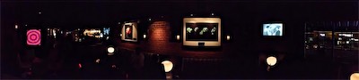 Cult of Ego II | Gallery Photo | Sky Bar | Panorama — I think this was taken on an iPhone 4S. The ability to do panoramic shots had just recently come out-ish. I like the idea of getting an atmosphere shot. Realistically, this is far too small dimensionally to actually work as a full wraparound panorama, but it's still kind of a cool shot, given the idea of what the overall bar looked like. This side of the bar only had these two pieces, though. The rest of them were in the back that you can see all the way to the left, where the actual bar is, up on the left side on all the pillars next to the windows. It was a cool spot.