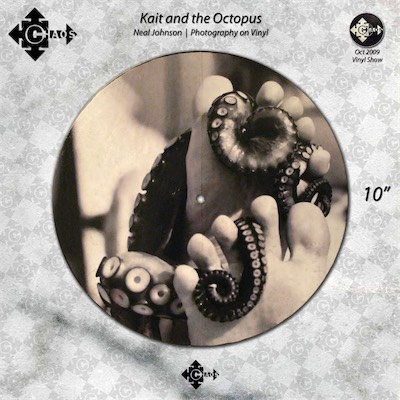 Kait and the Octopus — Neal Johnson, Photography on Vinyl. Part of the vinyl show, Chaos Gallery, shown in 2009 as a group show that I composed and put together. This is the other piece that I mentioned that I assisted with from my friend at the time, Neal Johnson. I assume I just printed one of his photographs in whatever method I was using to print the other ones I put on my three pieces and applied it to the record and just put the credit in his name. It didn't need to be known at the time that I was the one who actually created the gallery piece for him. It was his photograph, and I think it looked awesome.