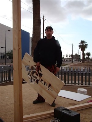 ©haos Gallery Sign — Not the greatest shot, bit blurry, but I like it. Has a very stark feel. Big chunk of wood with the logo chaos cut out of it. That's the kind of thing I like to do.
