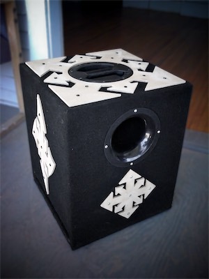 Chaos Subwoofer — A nice shot of the Chaos subwoofer that I built, with the little MDF chaos panels on the front, side, and top, big fat four-inch port in the front, handle in the middle top. And if you look on the left side, you can see a slot port, which goes all the way through to the other side. This thing was a beast.