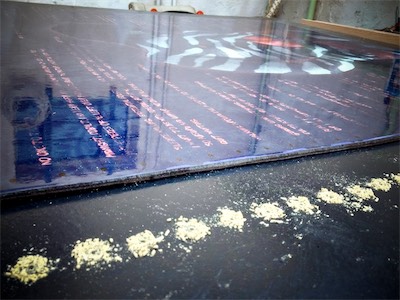 Transparency — Now we can see that it's a glossy foam core print, and I like the way that all of my pilot hole sawdust looked with an up-close long angle view, so I took a photo of it as a part of documenting my creative process.